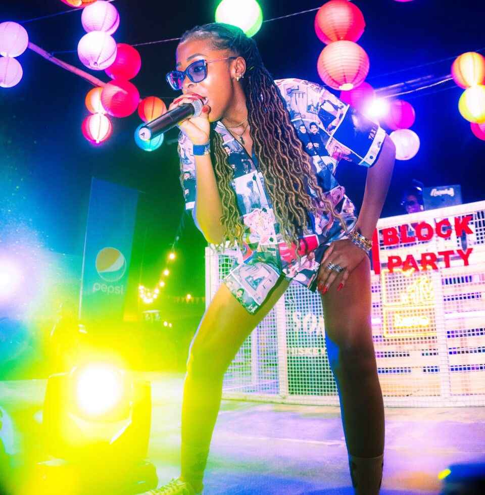 Photo of M.I.A performing on stage.
