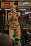 Photo of M.I.A performing on stage.
