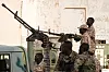A member of Sudan's Rapid Support Forces (RSF) paramilitaries mans a machine gun turret while on guard outside the offices of the anti-corruption prosecution in the capital Khartoum on June 16, 2019.