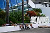 Workers rest next to a Cannes sign on the sidelines of the 79th edition of the Cannes Film Festival in Cannes, southern France, on May 11, 2026.