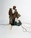 Nigerian producer Magicsticks poses against a white backdrop.