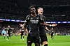 Bukayo Saka of Arsenal celebrates scoring his team's first goal with teammate Gabriel Martinelli during the UEFA Champions League 2024/25 Quarter Final Second Leg match between Real Madrid C.F. and Arsenal FC at Estadio Santiago Bernabeu on April 16, 2025 in Madrid, Spain.