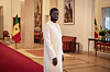 Senegal’s President Bassirou Diomaye Faye stands in a formal hall inside the Presidential Palace in Dakar.