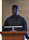 Ousmane Sonko stands behind a podium delivering remarks at a business forum in Istanbul.