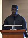 Ousmane Sonko stands behind a podium delivering remarks at a business forum in Istanbul.