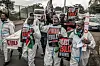 Activists chant slogans as they carry placards and a mock coffin during a protest against a US-built Ebola quarantine center planned to begin operations at Kenya's Laikipia Air Base, in Nairobi on June 2, 2026.