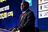 Cyril Ramaphosa speaks at a podium beside election results graphics at the IEC National Results Center in Johannesburg.