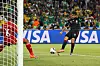 Mexico's Rafael Marquez shoots toward the goal as South Africa's goalkeeper dives in a World Cup match.
