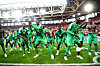 Senegal players celebrate on the pitch after their World Cup win at Spartak Stadium.