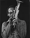 Jazz musician Miles Davis plays his trumpet at the Newport Jazz Festival in 1969 in Newport, Rhode Island.