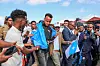 Somali referee Omar Abdulkadir Artan, draped in a flag, is greeted by fans in Mogadishu.