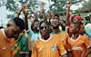 A man dances in sunglasses in a scene  from Abidjan singer Tam Sir’s  music video for “Coup Du Marteau.”