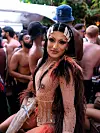 Ana Masreya is wearing a long black wig with big white clips and a nude bodysuit bedazzled with rhinestones.