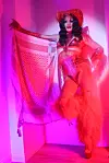 Ana Masreya is wearing an all-pink Americana-inspired costume with a pink kuffiyeh.