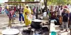 People prepare meals in an open-air kitchen at an IDP camp near Maiduguri, Nigeria.