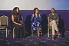 Three people sit in a panel session at NBO Film Festival.