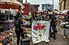 Health workers hold an Ebola awareness poster in a busy market street in Goma, Democratic Republic of Congo.