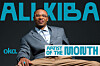 Promotional graphic of Alikiba seated in a blue blazer and tan trousers against a dark background.