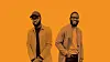 Peppeh Co.’s Emmanuel Obayemi and Clarence Quarcoo standing against an orange background.