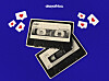 Playing cards, heart symbols, and dollar bills arranged on a blue surface.