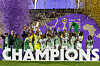 Nigeria players lift the trophy on the podium after winning the Women's Africa Cup of Nations final.