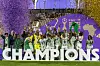 Nigeria players lift the trophy on the podium after winning the Women's Africa Cup of Nations final.