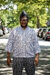 A photo of South African musician, teacher, and mentor PitsiRa YaMabala standing in the middle of a street.