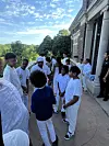 PitsiRa YaMabala and a group of students wearing white