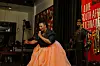 Bokang Ramatlapeng photographed mid-performance, wearing an orange skirt by Oracle Dynasty