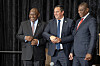 South African President Cyril Ramaphosa (L) smiles as South African Minister of Agriculture John Steenhuisen (C) shakes hands with South African Deputy President Paul Mashatile (R) at the sitting of the South African Parliament for the swearing in of Cabinet Ministers, on July 03, 2024, in Cape Town.