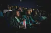 A cross-section of attendees watching a movie at NBO Film Festival.