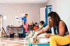 A group of people in a ceramics making class.