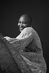 A black and white image of poet Wana Udobang.