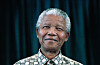 Former President Nelson Mandela of South Africa smiles as he receives visitors on March 8, 1999 in his residence in Houghton, a suburb of Johannesburg, South Africa.