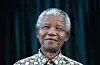 Former President Nelson Mandela of South Africa smiles as he receives visitors on March 8, 1999 in his residence in Houghton, a suburb of Johannesburg, South Africa.