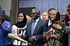 Aliko Dangote stands with guests at a Dangote Refinery IPO ceremony in Lagos as attendees applaud.