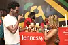 An image of two people holding a drink close together.