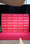 A photo backdrop with the Hennessy and OkayAfrica logos