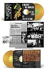 Vinyl box set with gold records, newspaper inserts, and black-and-white concert photographs.