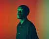 Zwide Serves Bass poses against a technicolor background in new promo image.