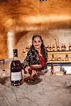 South Africa’s Roxanne Read hands over a Hennessy cocktail.