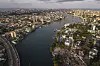 Aerial view of Lagos Island and Victoria Island separated by a wide waterway and surrounded by dense development.