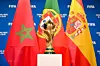A view of the FIFA World Cup Winner's Trophy with the flags of the FIFA World Cup 2030 hosts Morocco, Portugal and Spain during a trophy shoot at the Home of FIFA on December 11, 2024 in Zurich, Switzerland.