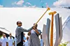 Rwandan President Paul Kagame and first lady Jeannette Kagame light the flame of remembrance during the commemoration of the 29th anniversary of the 1994 genocide against Tutsis at the Kigali Genocide Memorial in Kigali, Rwanda, April 7, 2023.