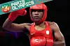 A photo of Cindy Ngamba of Refugee Olympic Team reacting after winning the women's 75kg quarter-final match against Davina Michel of Team France on day nine of the Olympic Games Paris 2024 at North Paris Arena on August 04, 2024 in Paris, France.