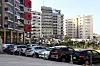 Cars are parked near apartment buildings in Dakar on February 6, 2020, where rising rents have become a headache for tenants.