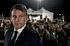 France's President Emmanuel Macron looks on during a Christmas dinner at the Air Base 188 'Colonel Massart' in Djibouti, as part of a two-day visit to Djibouti to celebrate Christmas with the French forces deployed in the country, on December 20, 2024.