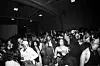 A large crowd of partygoers dancing and mingling inside a warehouse during a Motherland Sounds event in Los Angeles.