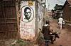 Transporters pass by graffiti supporting opposition leader Robert Kyagulanyi, also known as Bobi Wine, near the headquarters of National Unity Platform (NUP) in Kampala, Uganda, on January 18, 2021.