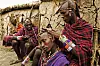 Maasai people. Men spend hours braiding each othersí long ochred colored hair. Near Amboseli National Park, Kenya